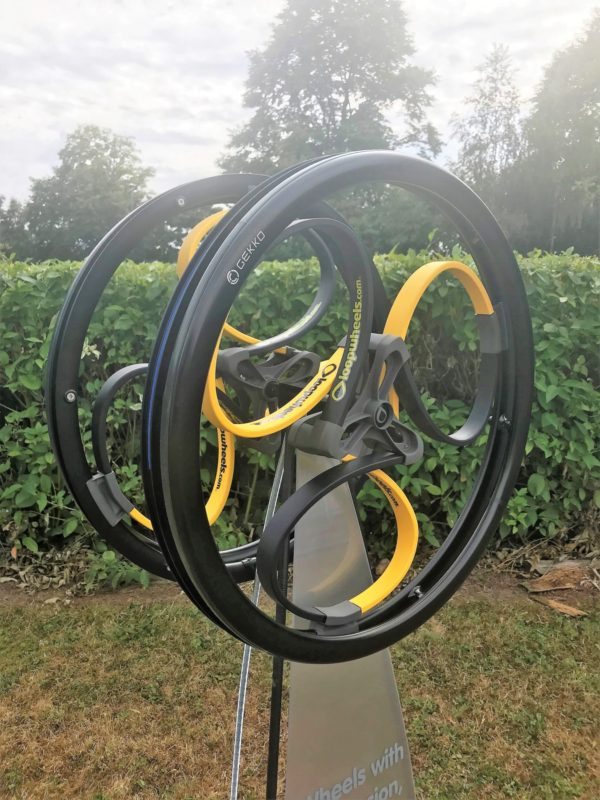 Black and yellow coloured wheelchair wheels